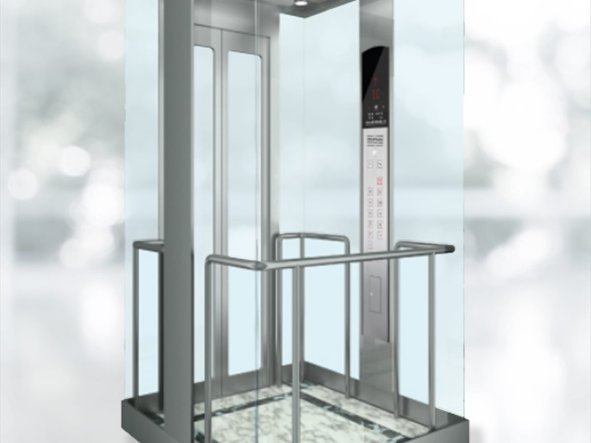 Glass elevator cabin interior looking out over a showroom floor