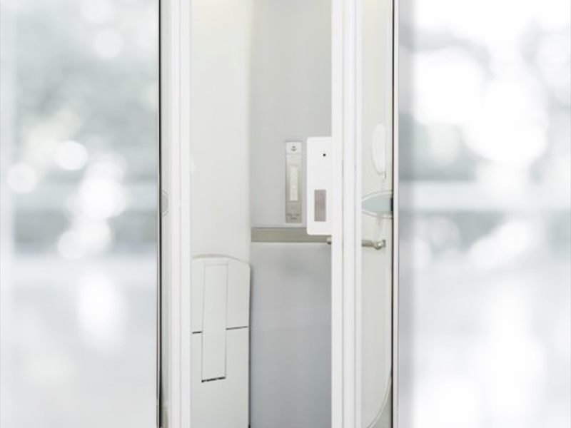 Bank of smart lifts in a corporate office lobby