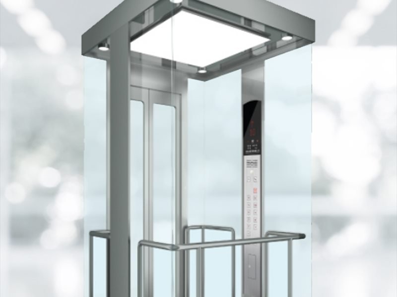 Self-supporting steel and glass elevator shaft seen from below